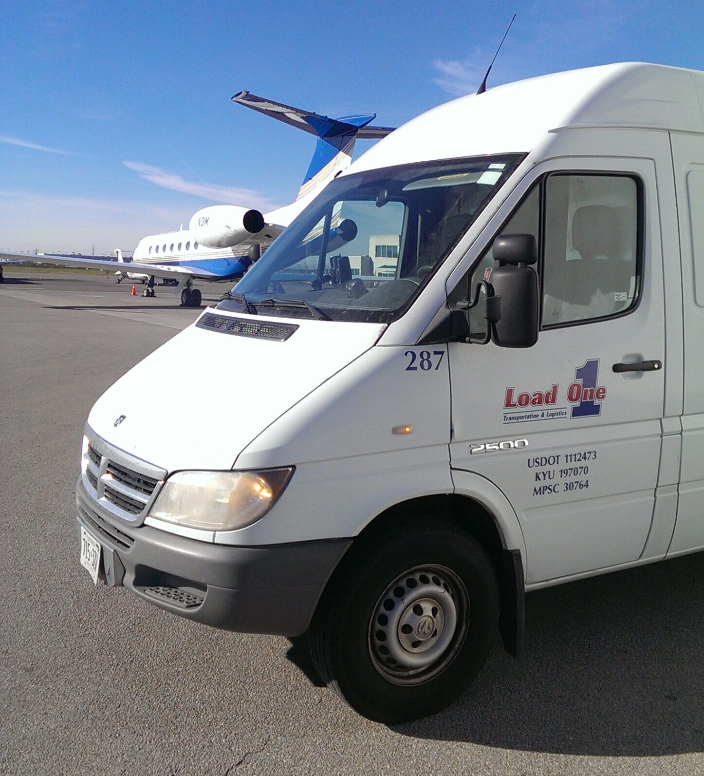 Load one van in front of airplane