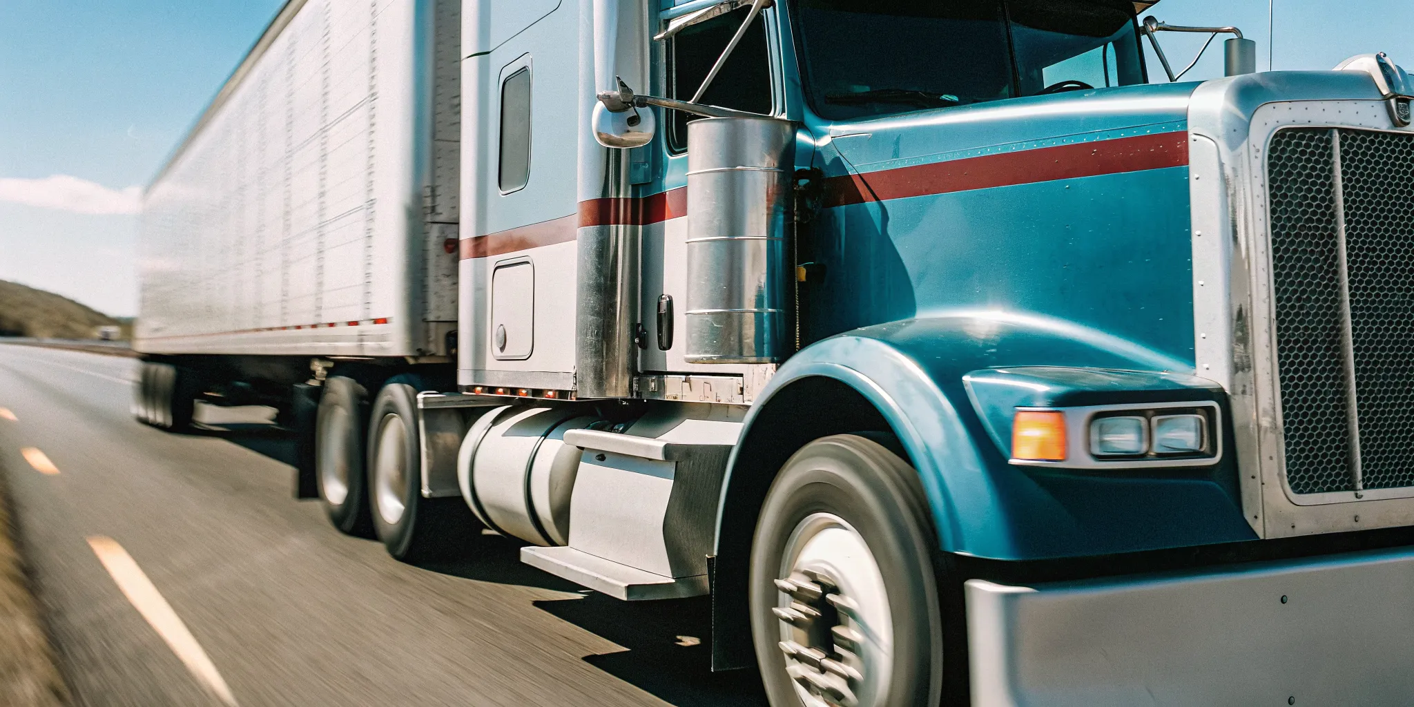 Expedited freight truck moving on a highway to protect production uptime