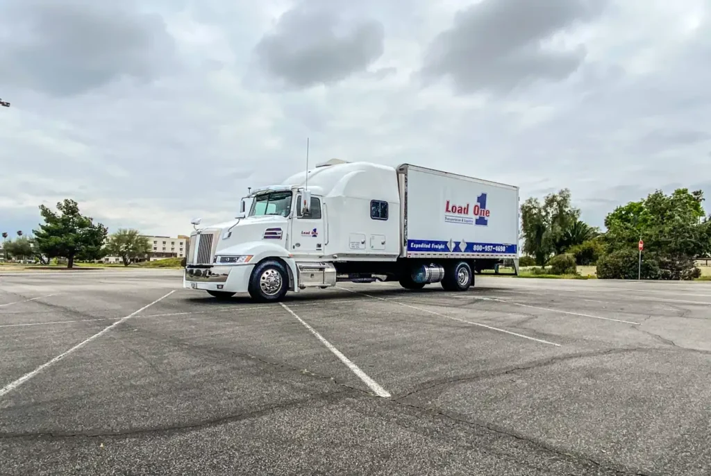Load-one-truck-in-parking-lot-scaled-e1679609187145.upload