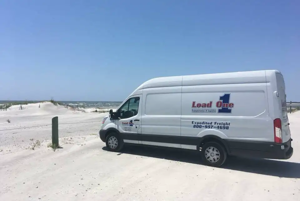Transit-van-at-beach-e1679609253452.upload
